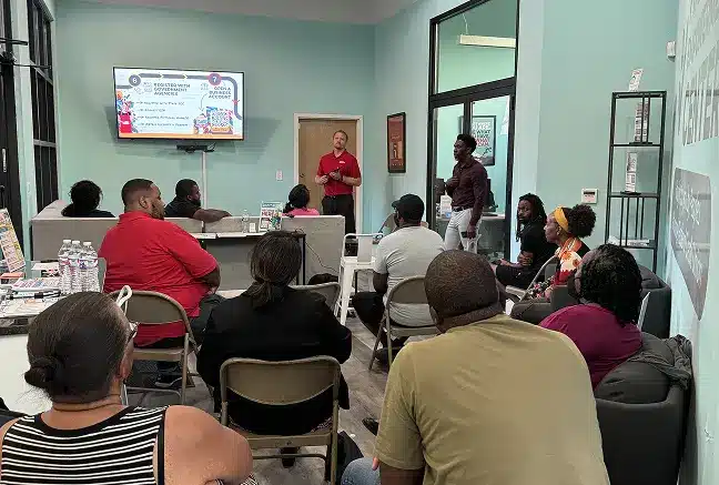 Program participants listening to a presentation
