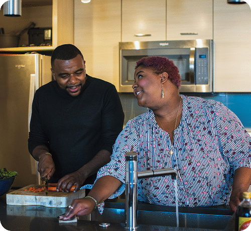 Couple prepping dinner in a modern kitchen