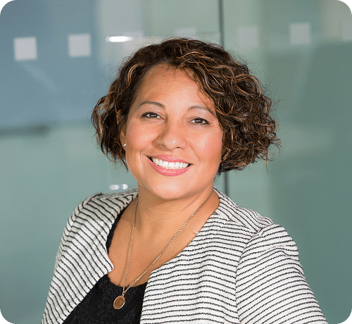 Woman smiling at camera in office setting